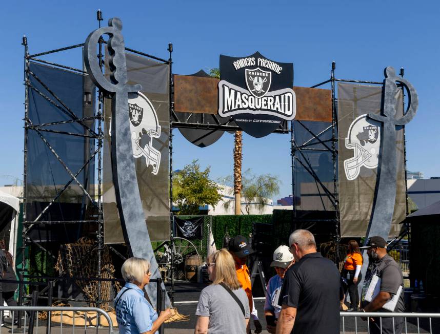 Fans enter the new Raiders Pregame Masqueraid venue in the tailgate before the first half of th ...