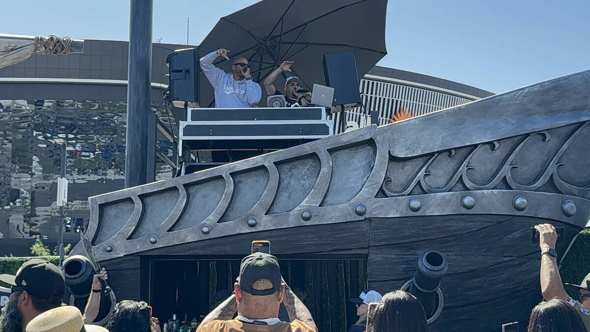 Rapper Warren G performs for those in attendance at the Masqueraid VIP tailgate space in Lot B ...