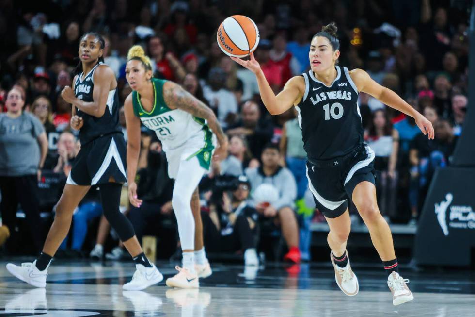 Aces guard Kelsey Plum (10) rushes the ball across the court during game one of a WNBA playoff ...