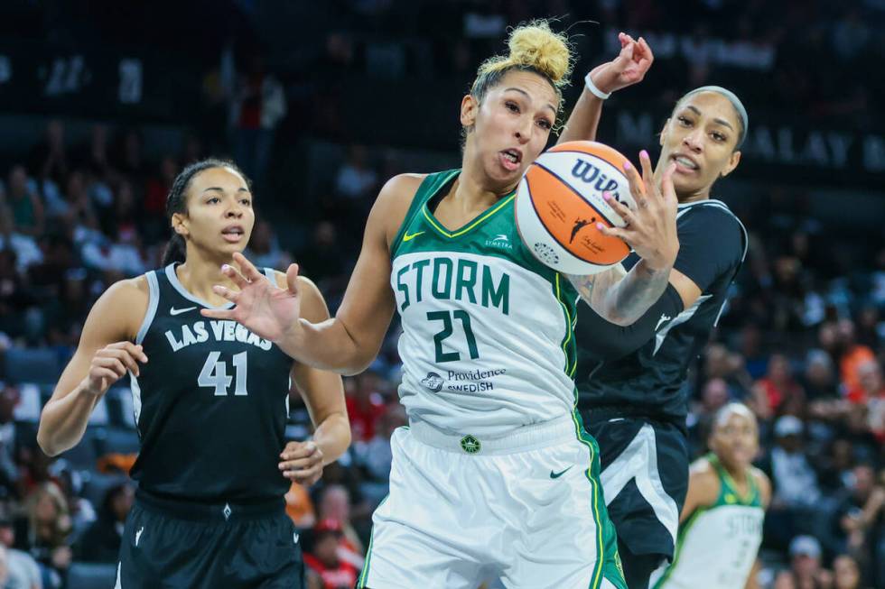 Seattle Storm center Mercedes Russell (21) rushes to keep the ball from falling out of her grip ...