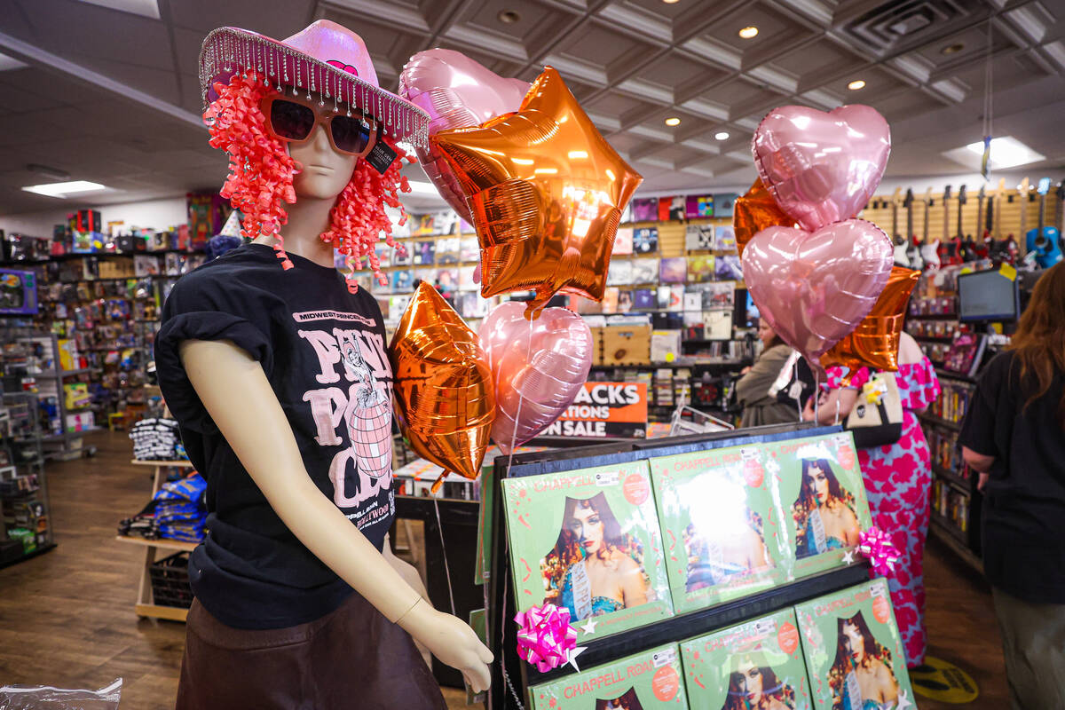 A mannequin sports a “Pink Pony Club” shirt to welcome fans in during a listening ...