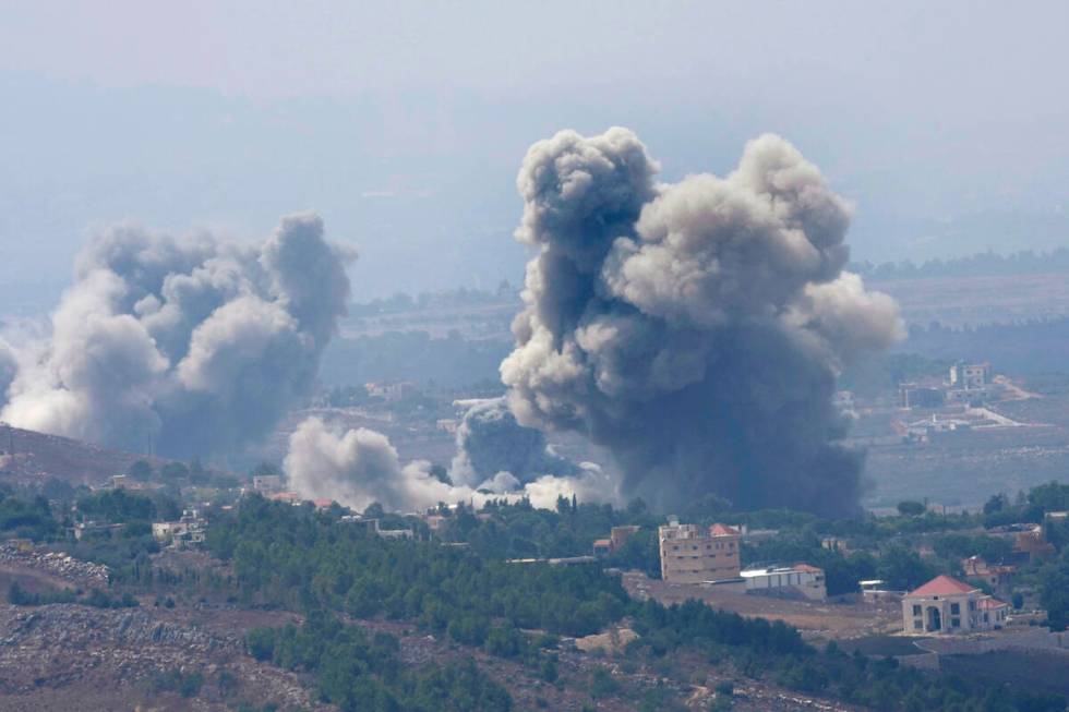 Smoke rises from Israeli airstrikes on villages in the Nabatiyeh district, seen from the southe ...