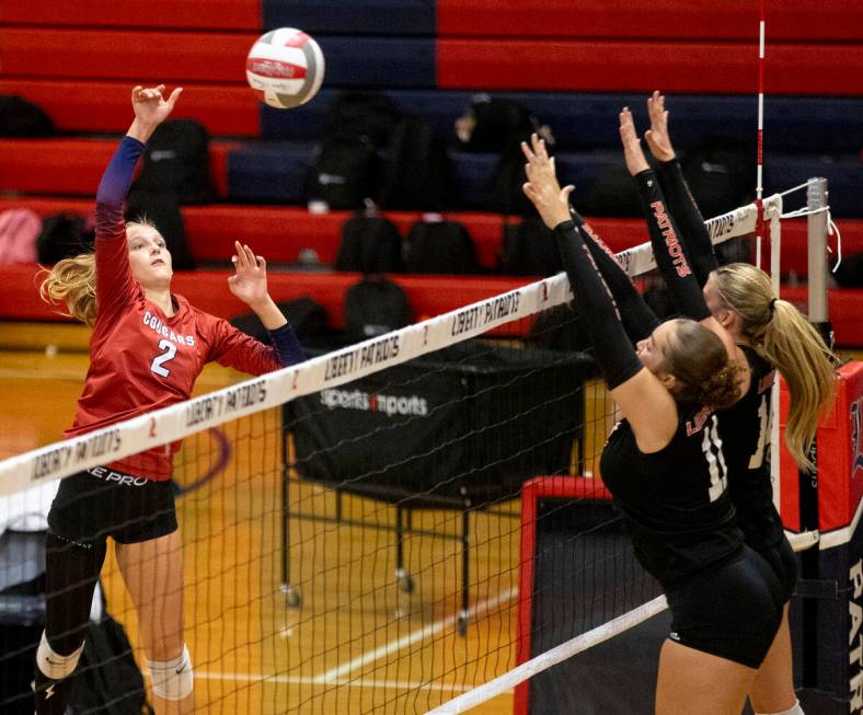 Coronado junior Julie Beckham (2) spikes the ball during the high school volleyball game agains ...