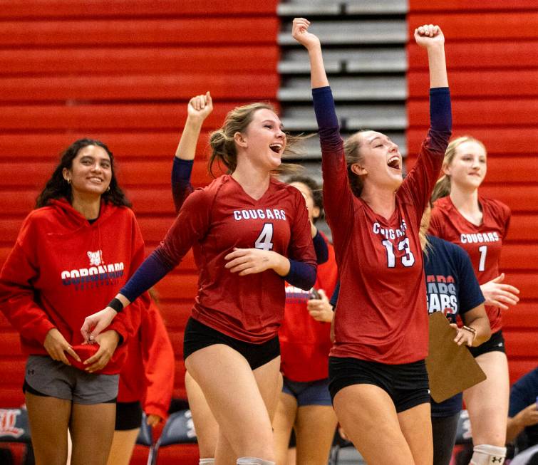 The Coronado bench runs out onto the court to celebrate after winning the high school volleybal ...