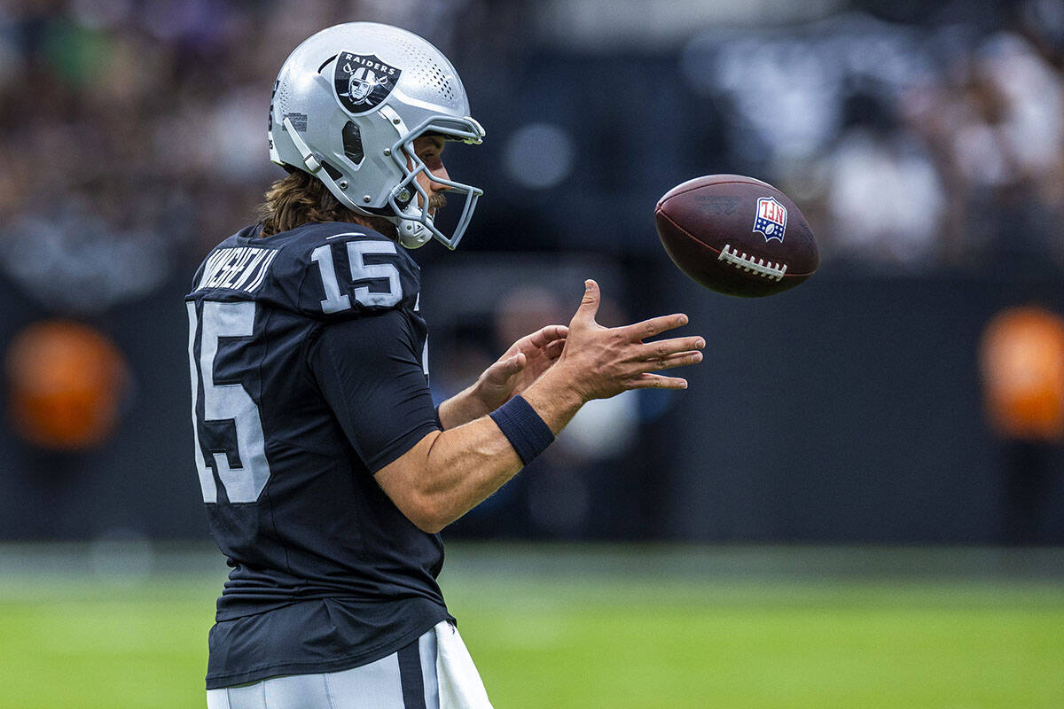 Raiders quarterback Gardner Minshew (15) looks in the ball during the first half of their NFL g ...