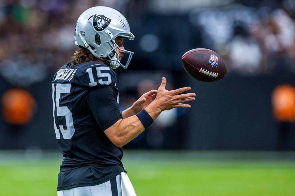 Raiders quarterback Gardner Minshew (15) looks in the ball during the first half of their NFL g ...