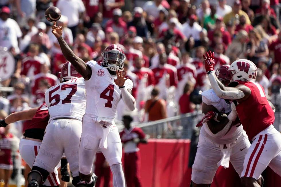 Alabama's Jalen Milroe (4) thorws a pass during the second half of an NCAA college football gam ...