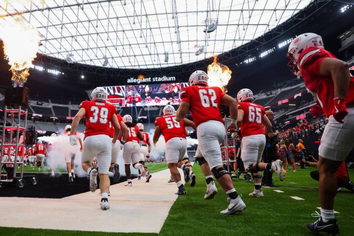 UNLV makes its way onto the field during an NCAA football game between UNLV and Utah Tech at Al ...