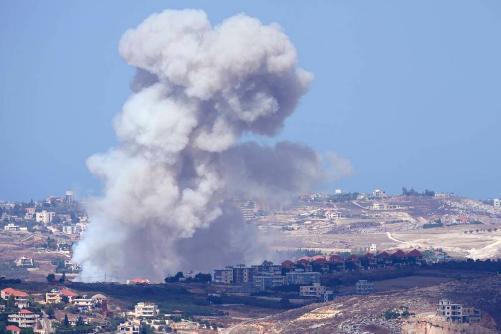 Smoke rises from Israeli airstrikes on villages in the Nabatiyeh district, seen from the southe ...