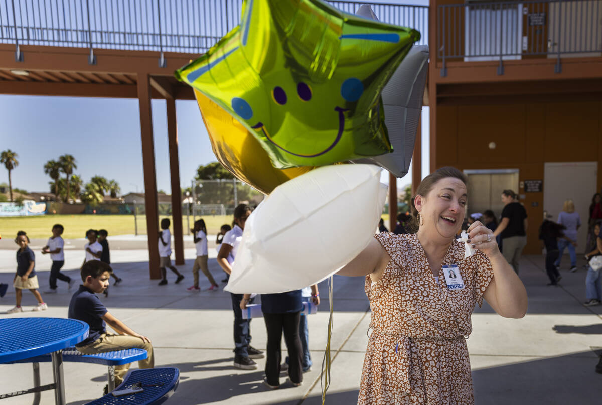 Pre-K teacher Leigh Todd of Tate Elementary School reacts after being named early educator of t ...