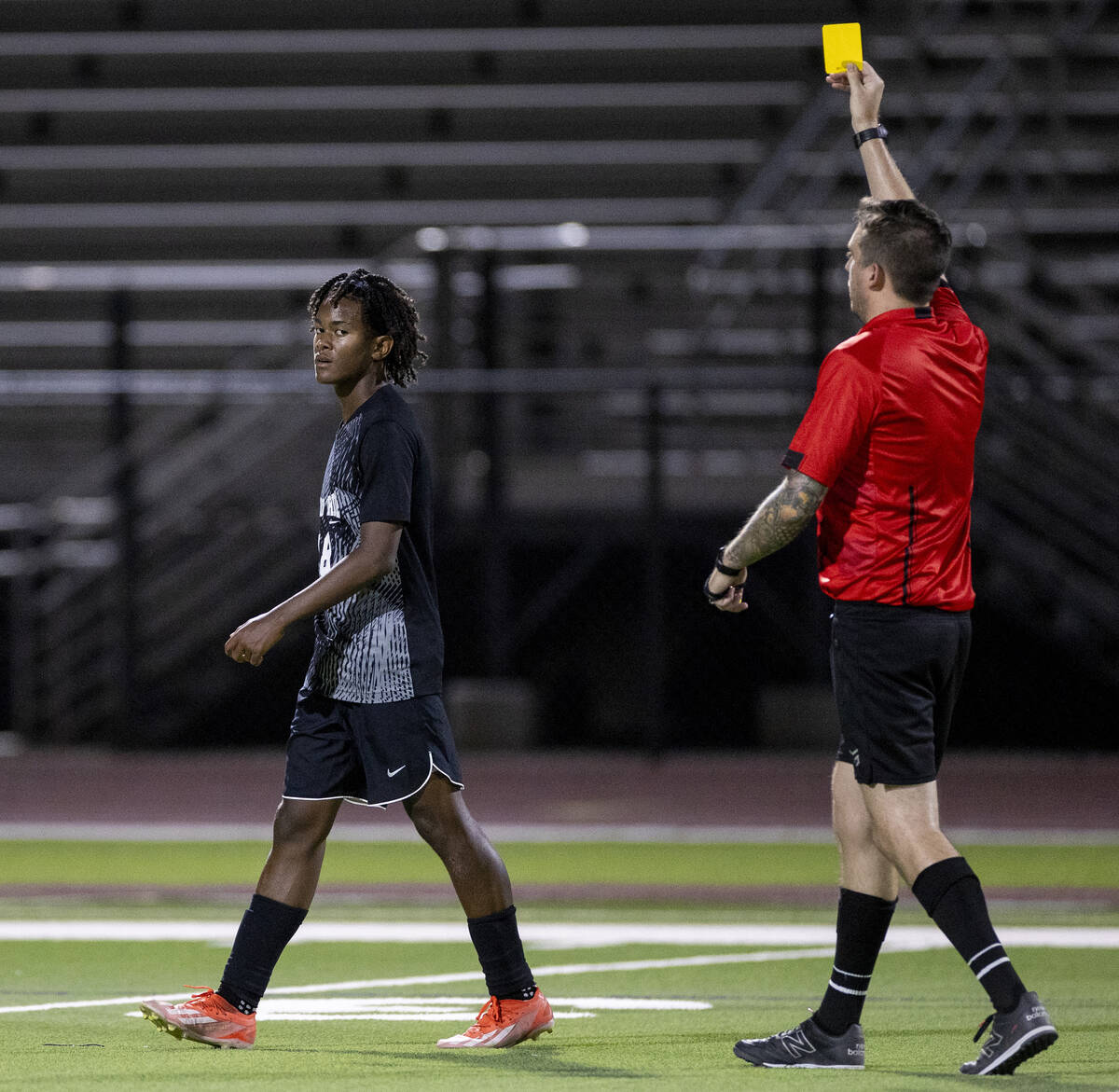 Palo Verde sophomore Shilo Stephenson (18) receives a yellow card during the high school soccer ...