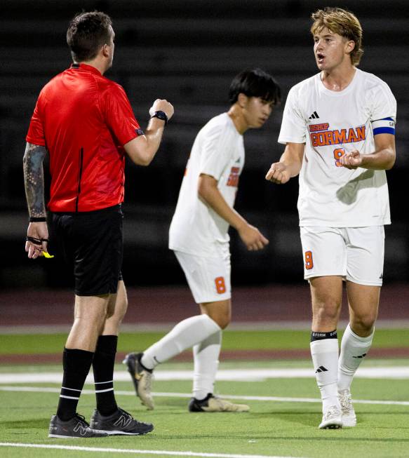 Bishop Gorman forward Chase Stewart (9) talks with a referee during the high school soccer game ...