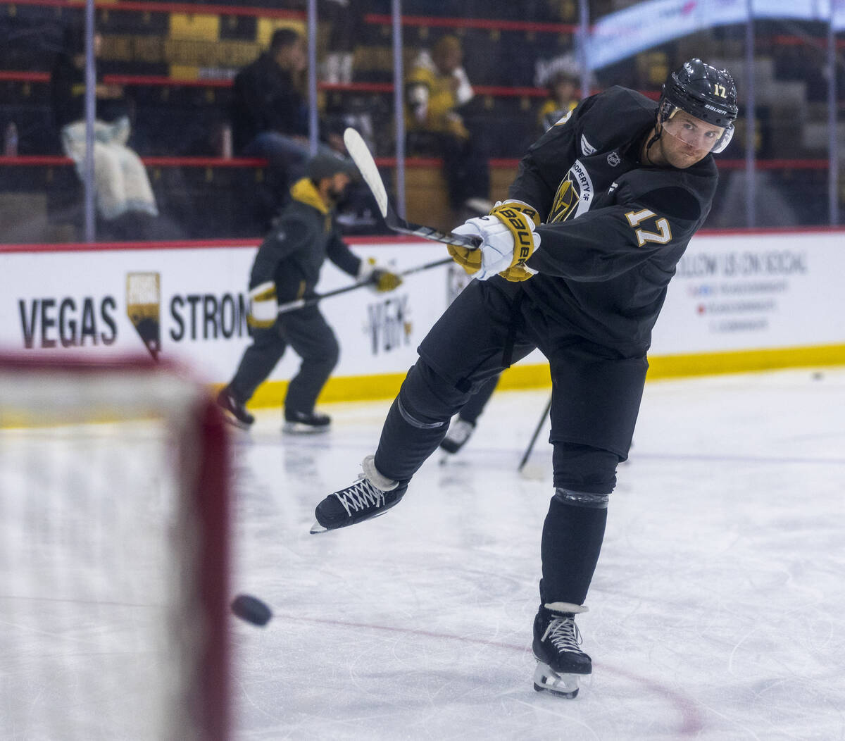 Golden Knights defenseman Ben Hutton (17) takes a shot at the goal during training camp at City ...