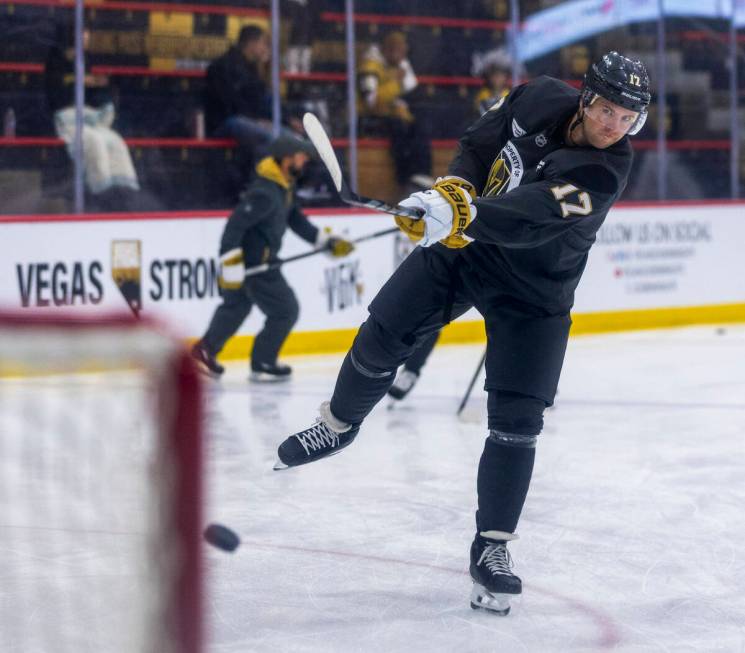 Golden Knights defenseman Ben Hutton (17) takes a shot at the goal during training camp at City ...