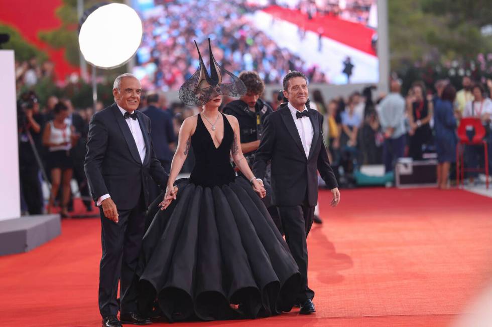 Venice Film Festival Artistic Director Alberto Barbera, from left, Lady Gaga and Pietrangelo Bu ...