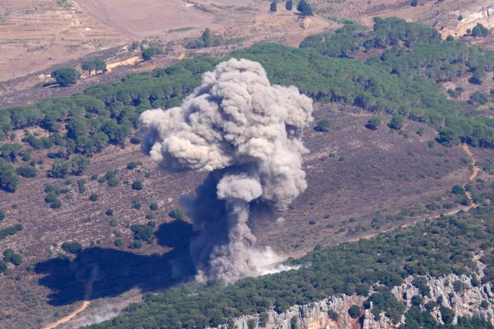 Smoke rises from an Israeli airstrike on the Mahmoudieh mountain, as seen from Marjayoun town, ...