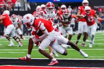 UNLV wide receiver Ricky White III (11) lands in the end zone for a touchdown during an NCAA fo ...