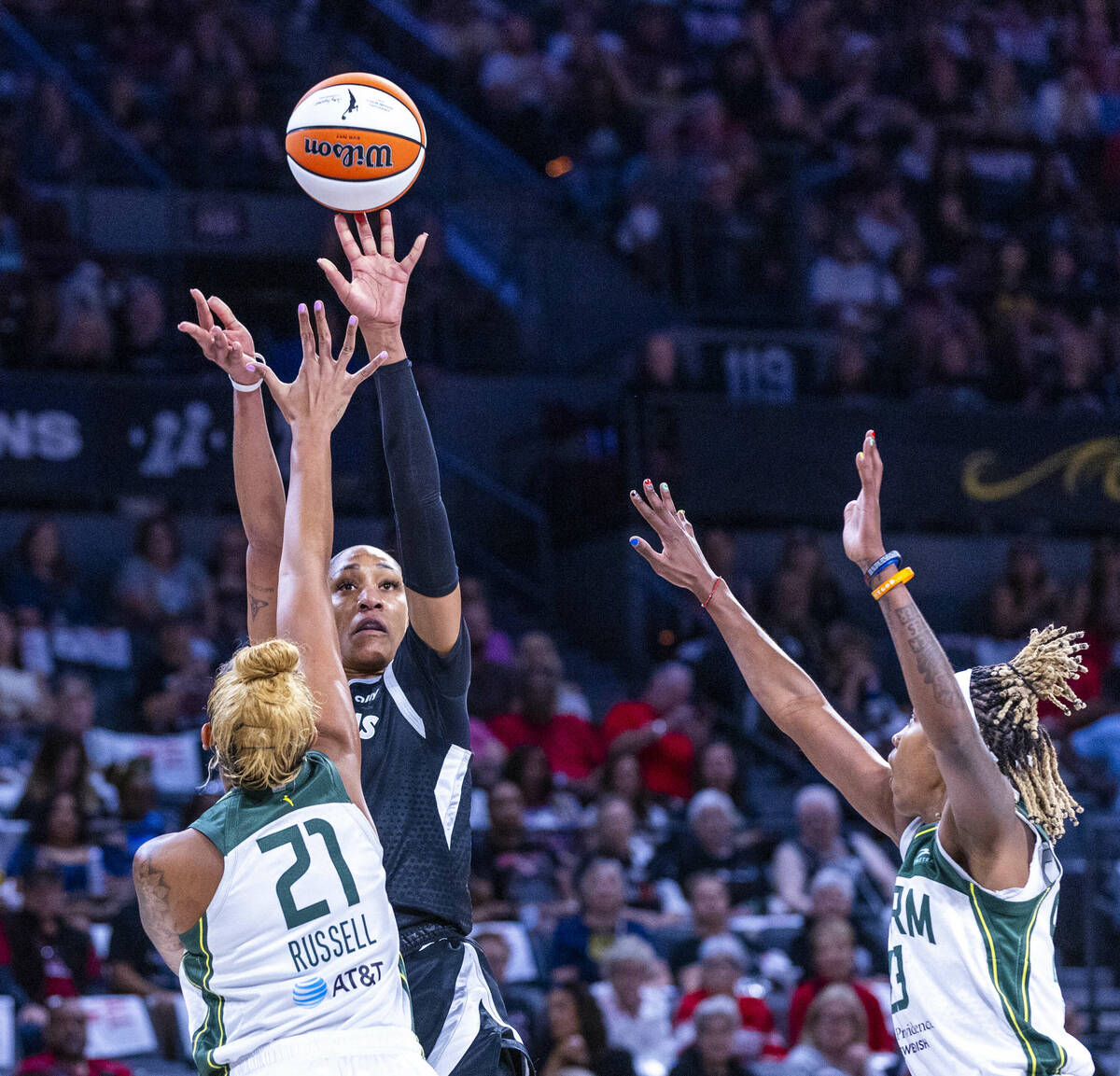 Aces center A'ja Wilson (22) looks to shoot over Seattle Storm center Mercedes Russell (21) dur ...