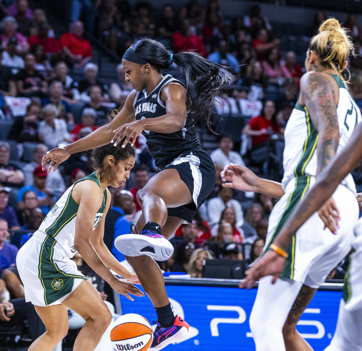 Aces guard Jackie Young (0) has the ball stripped by Seattle Storm guard Skylar Diggins-Smith ( ...