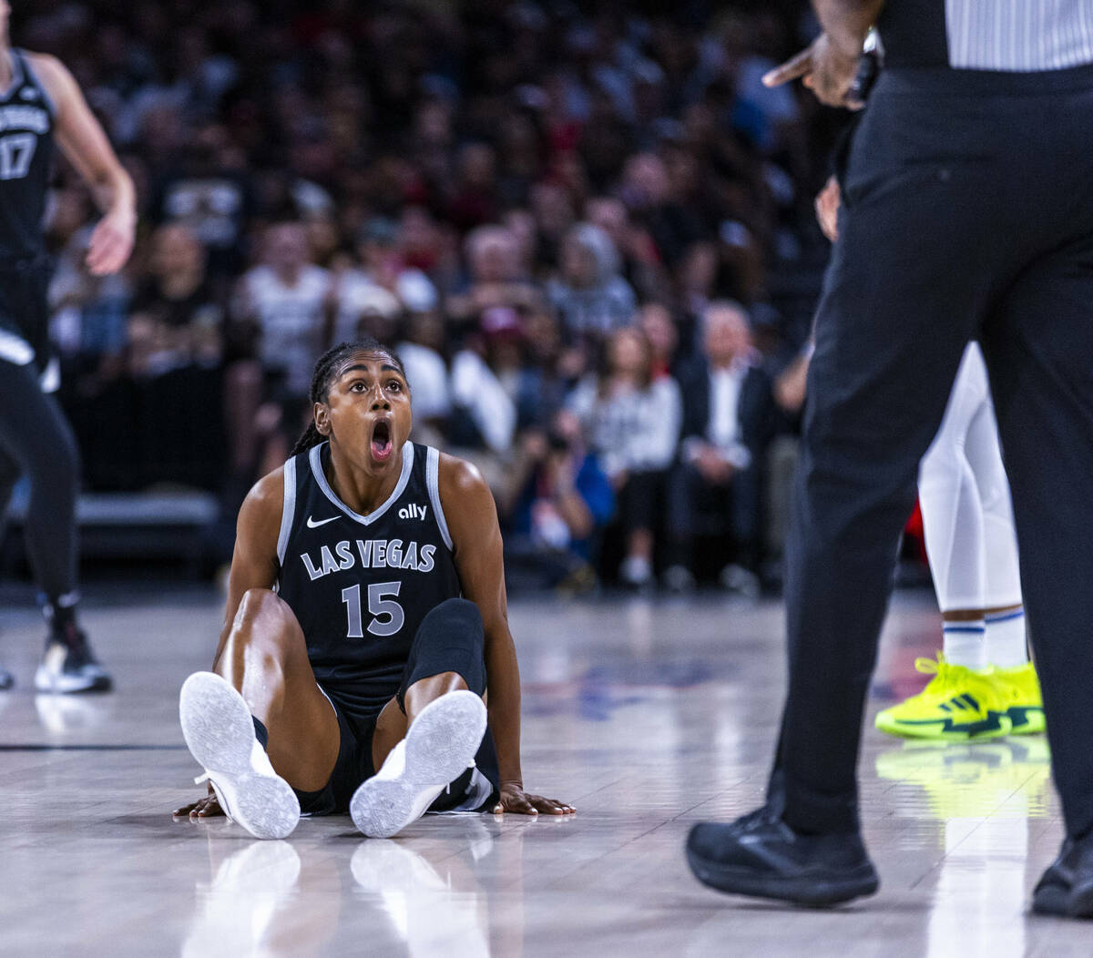 Aces guard Tiffany Hayes (15) is stunned by no foul call on a drive during the first half of th ...