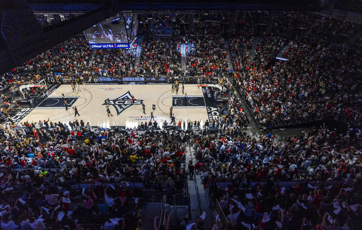 Teams take the court as the fans twirl their towels during the second half of their WNBA playof ...