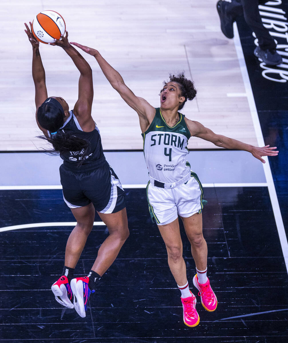 Aces guard Jackie Young (0) gets off. shot as Seattle Storm guard Skylar Diggins-Smith (4) near ...