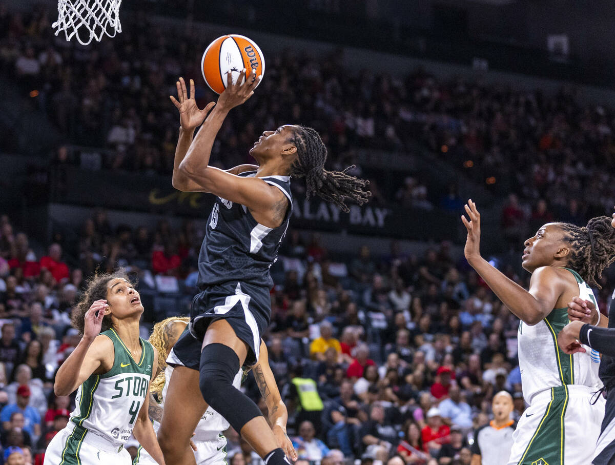 Aces guard Tiffany Hayes (15) gets to the hoop over Seattle Storm guard Skylar Diggins-Smith (4 ...