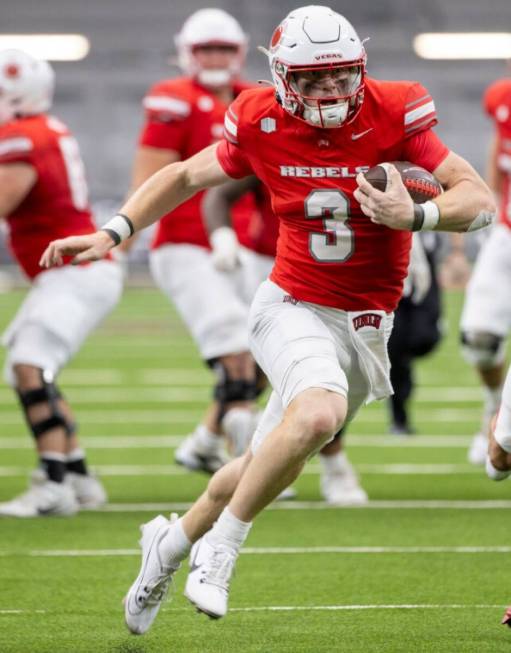 UNLV quarterback Matthew Sluka (3) runs with the ball during the college football game against ...