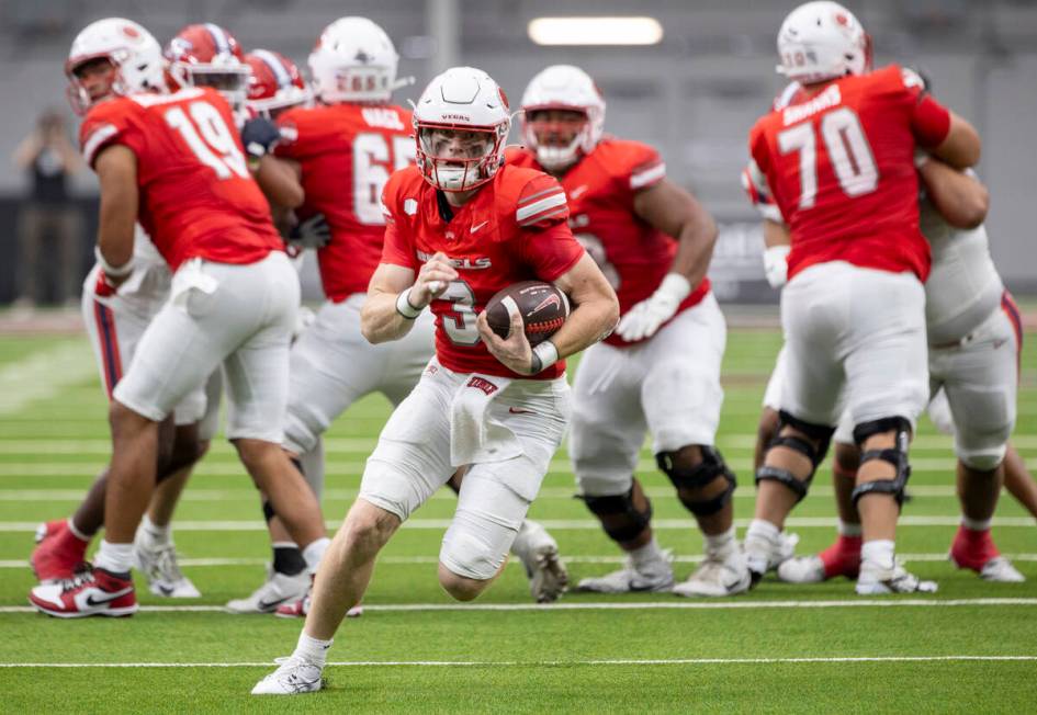 UNLV quarterback Matthew Sluka (3) runs with the ball during the college football game against ...