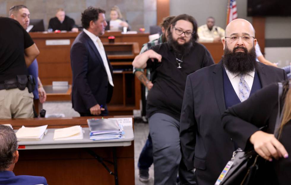 Joshua Rios, right, one of 11 indicted alleged motorcycle gang members, appears in court at the ...