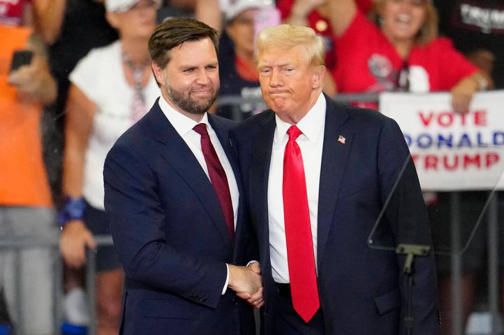 Republican vice presidential candidate Sen. JD Vance, R-Ohio, left, and Republican presidential ...