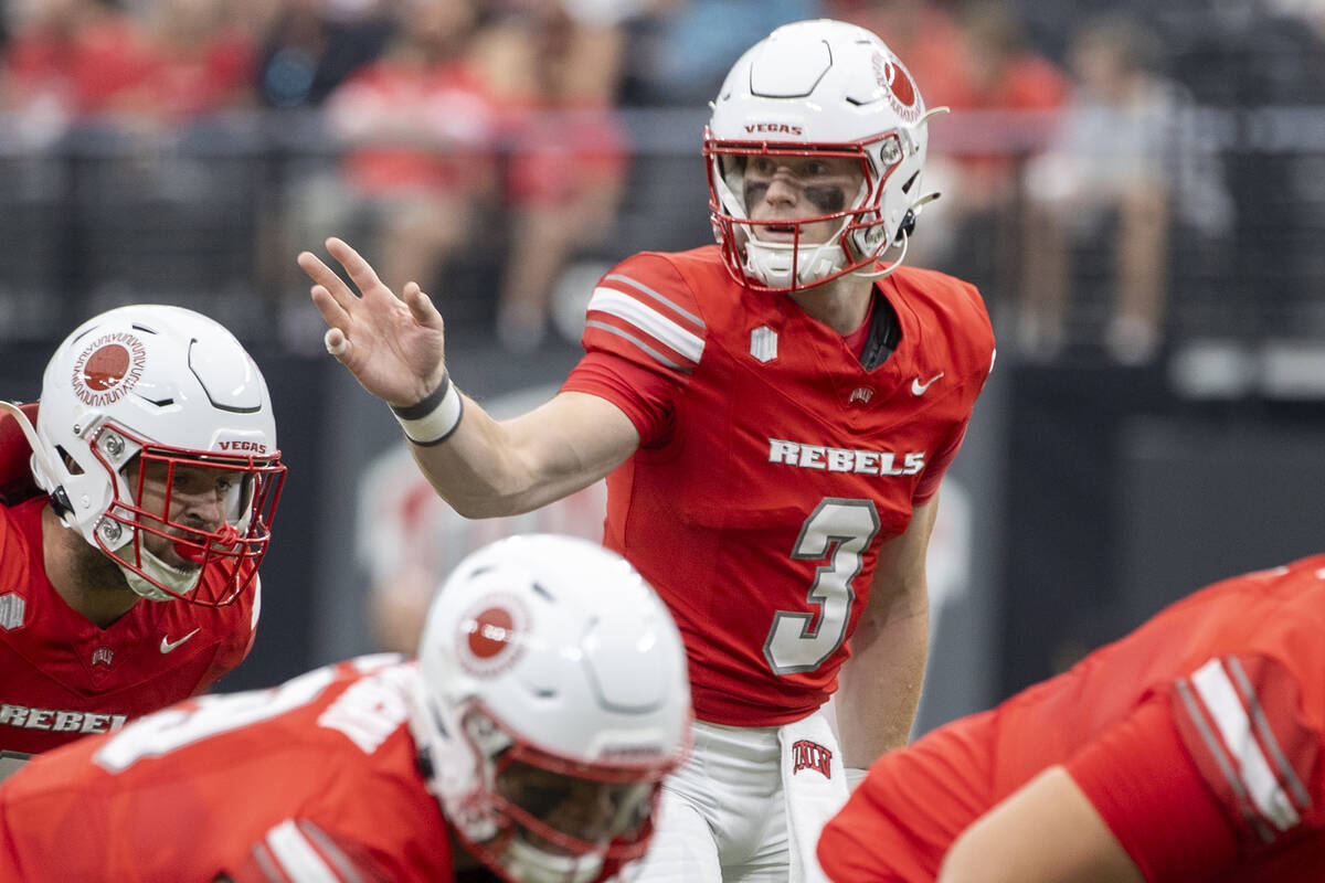 UNLV quarterback Matthew Sluka (3) directs the offensive line during the college football game ...