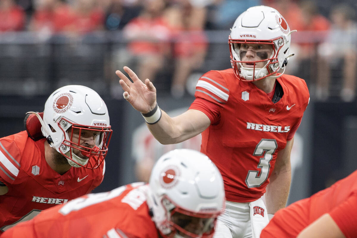 UNLV quarterback Matthew Sluka (3) directs the offensive line during the college football game ...