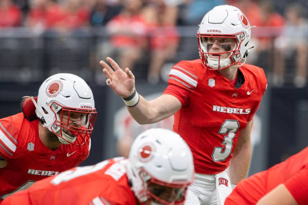 UNLV quarterback Matthew Sluka (3) directs the offensive line during the college football game ...