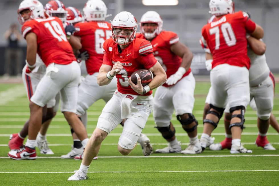 UNLV quarterback Matthew Sluka (3) runs with the ball during the college football game against ...