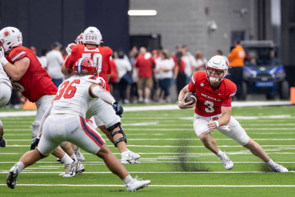 UNLV quarterback Matthew Sluka (3) runs with the ball during the college football game against ...