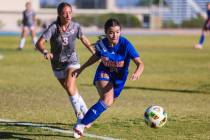 Bishop Gorman midfielder Stephenie Hackett (10) chases the ball during a high school soccer gam ...