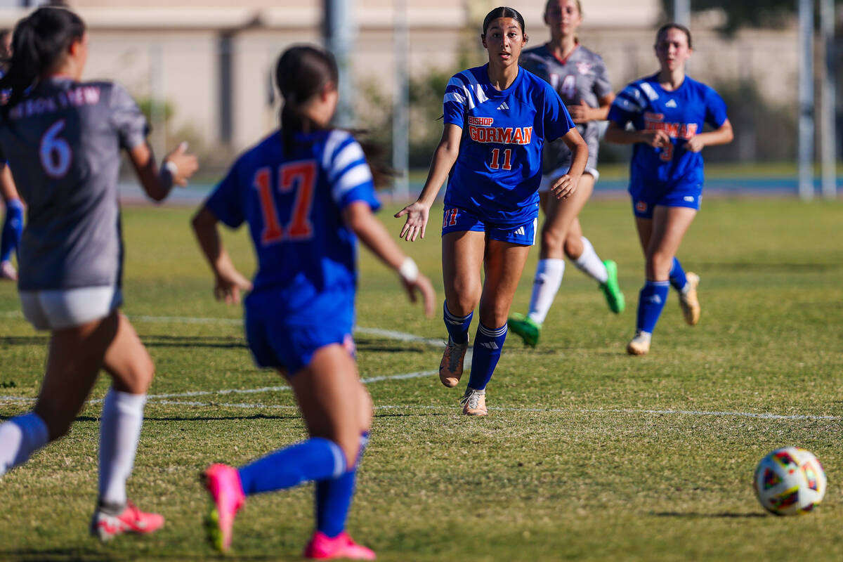 Bishop Gorman midfielder Devyn Giraldo (11) yells to her teammate Mikayla LeCavalier (17) durin ...