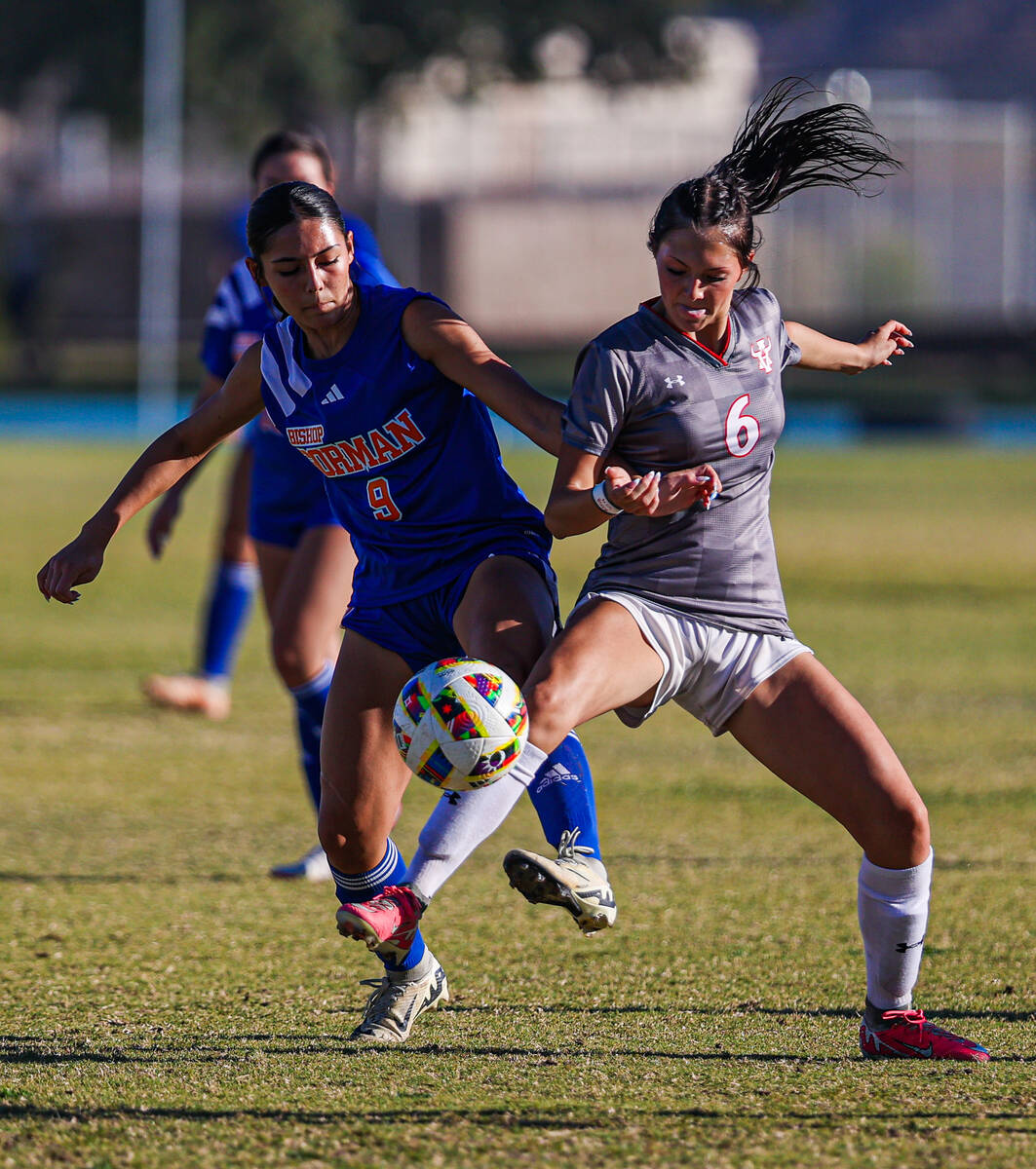 Bishop Gorman forward Alana Moore (9) and Arbor View’s Cadence Atkina (6) battle out for ...