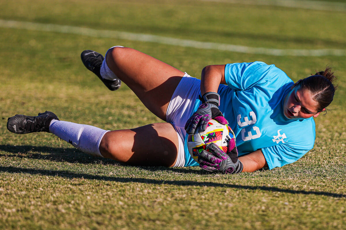 Arbor View goalkeeper Emily Rehmel (33) makes a save during a high school soccer game between B ...