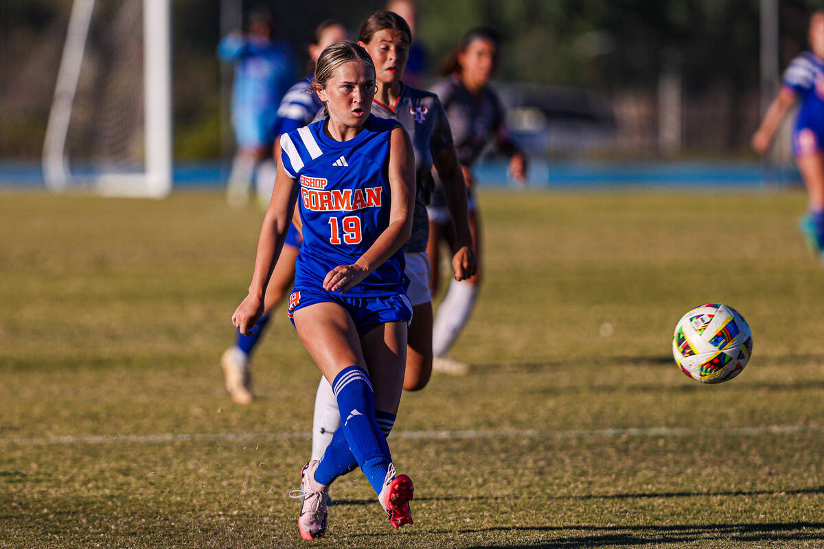 Bishop Gorman forward Riley Rohr (19) passes the ball to a teammate during a high school soccer ...