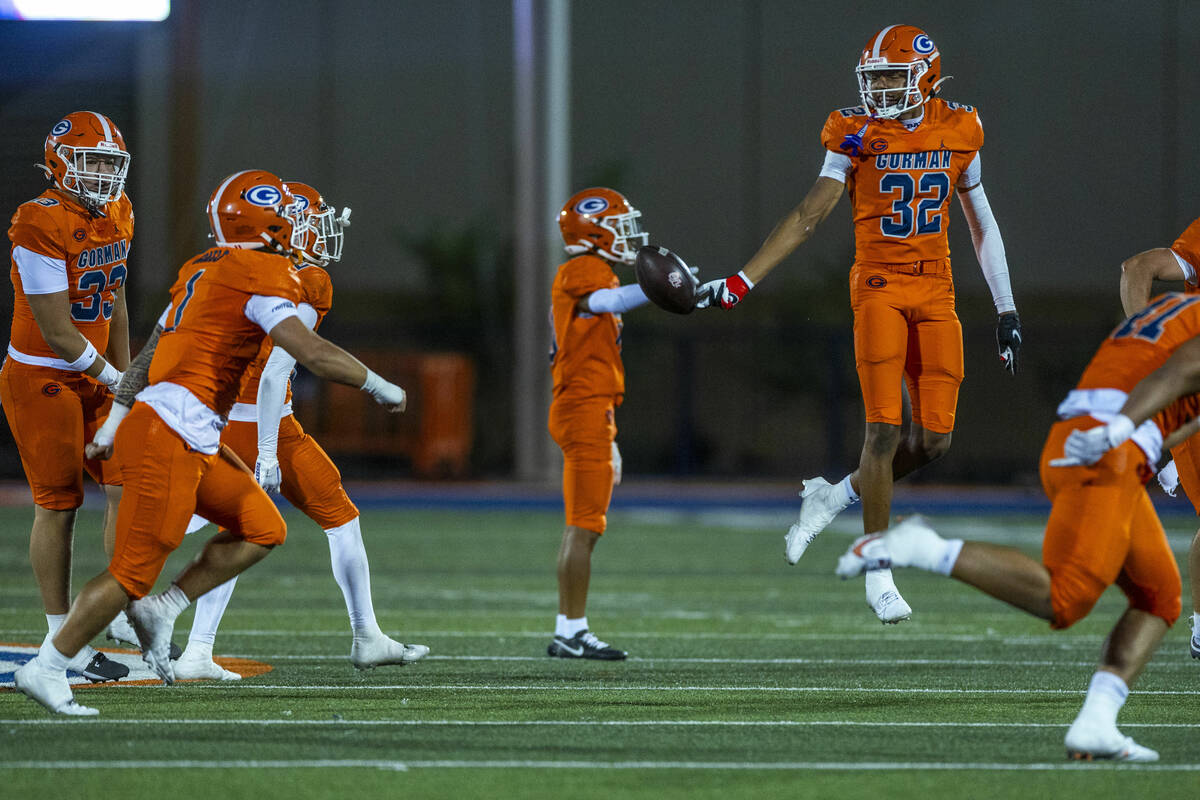 Bishop Gorman cornerback Hayden Stepp (32) celebrates a fumble recovery by Orange Lutheran quar ...