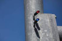 Red light indicators on a street light pole at the intersection of Eastern Avenue and Horizon R ...