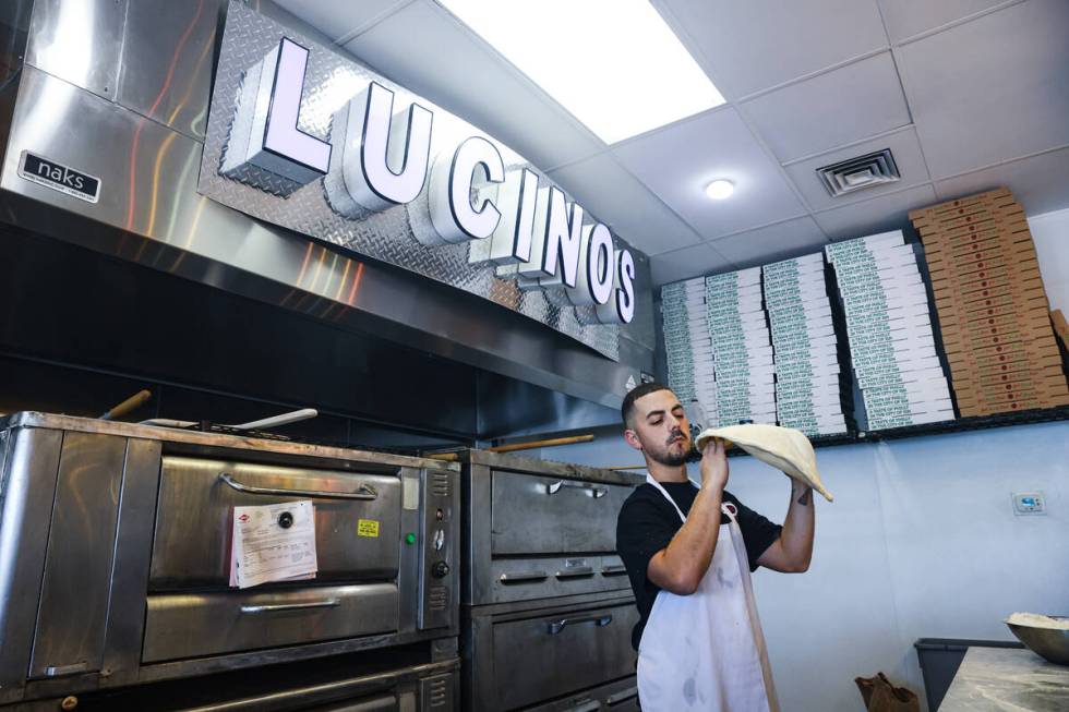 Owner Joey Scolaro tosses pizza dough at Lucino’s pizza in Las Vegas, Thursday, Sept. 26 ...