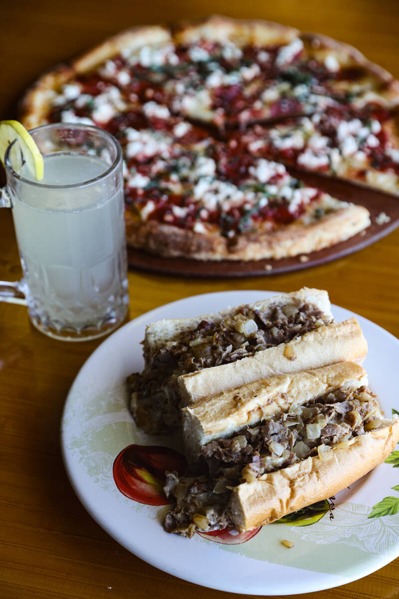 The Classic Philly Cheesesteak Sandwich a Liscio's roll tossed with chopped fried onion and top ...