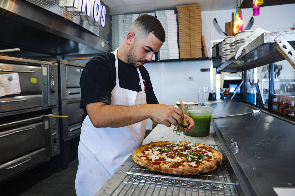 Owner Joey Scolaro prepares the Upside Down Pizza at Lucino’s Pizza in Las Vegas, Thursday, S ...