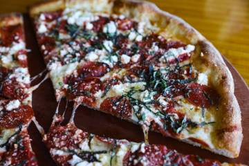 The Upside Down Pizza made with garlic herb oil, mozzarella, pepperoni, pecorino Romano and ric ...