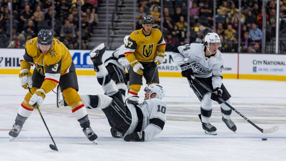 Golden Knights defenseman Brayden McNabb (3) takes out Los Angeles Kings left wing Tanner Jeann ...