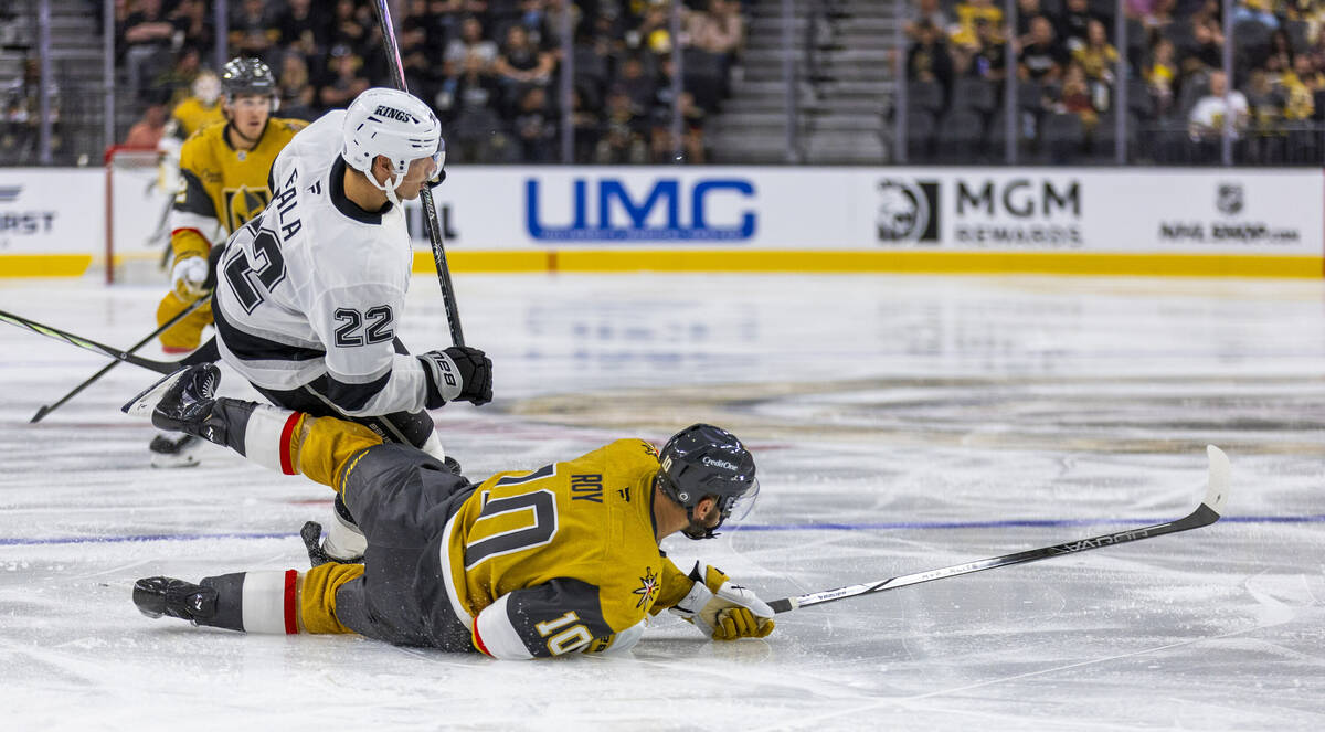 Golden Knights center Nicolas Roy (10) is taken down after a pass by Los Angeles Kings left win ...