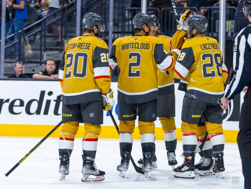 Golden Knights players celebrate the first goal against the Los Angeles Kings during the secon ...